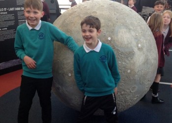 Two students with moon